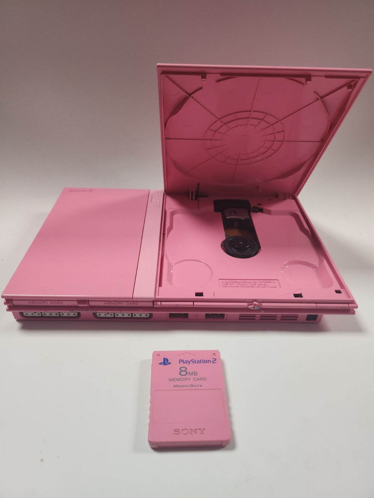 Roze Playstation 2, 2 controllers, roze memorycard en alle kabels - Feniks Gameshop
