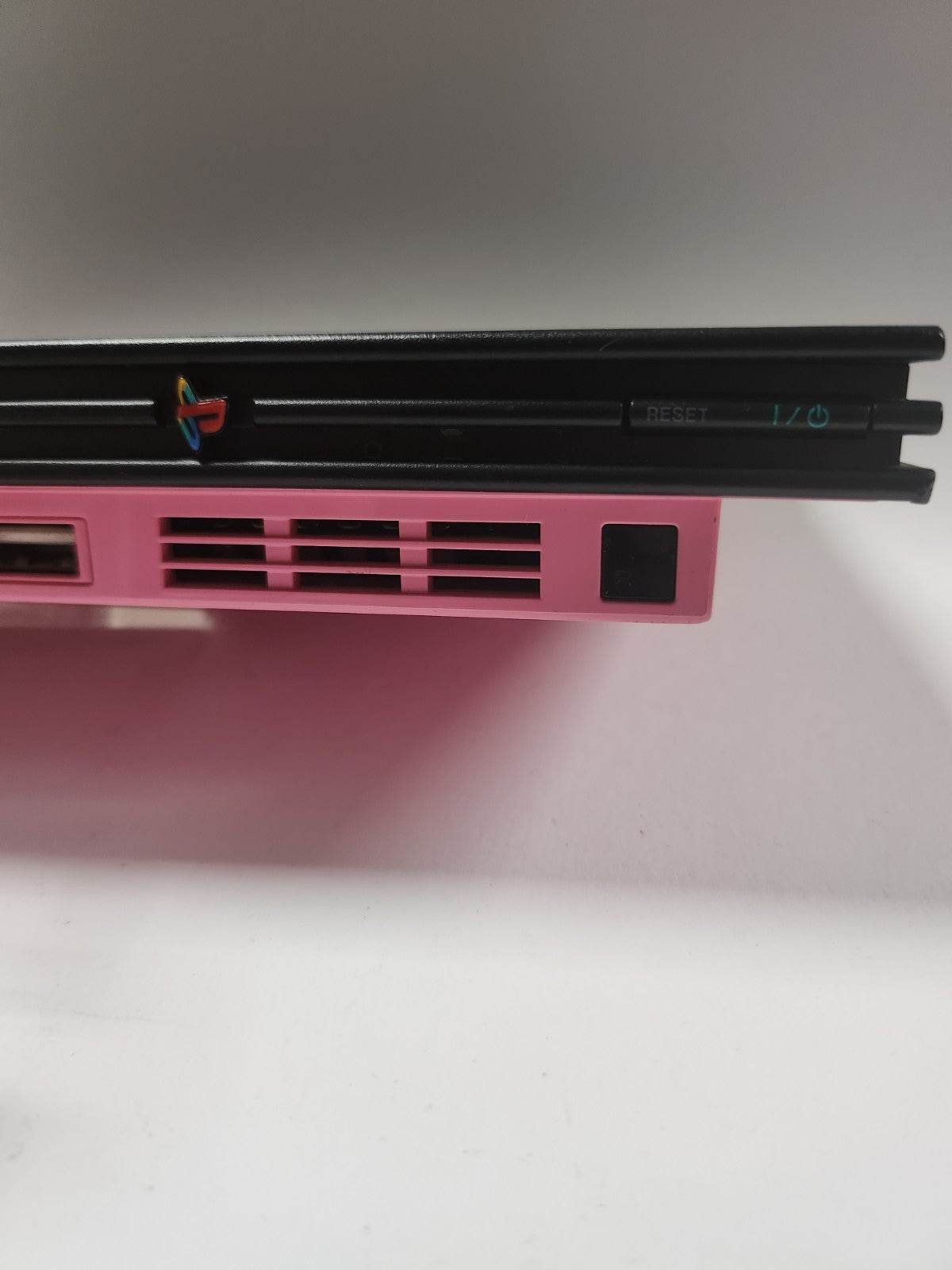 Roze zwarte Playstation 2 Slim, 2 controllers, memorycard en alle kabels - Feniks Gameshop