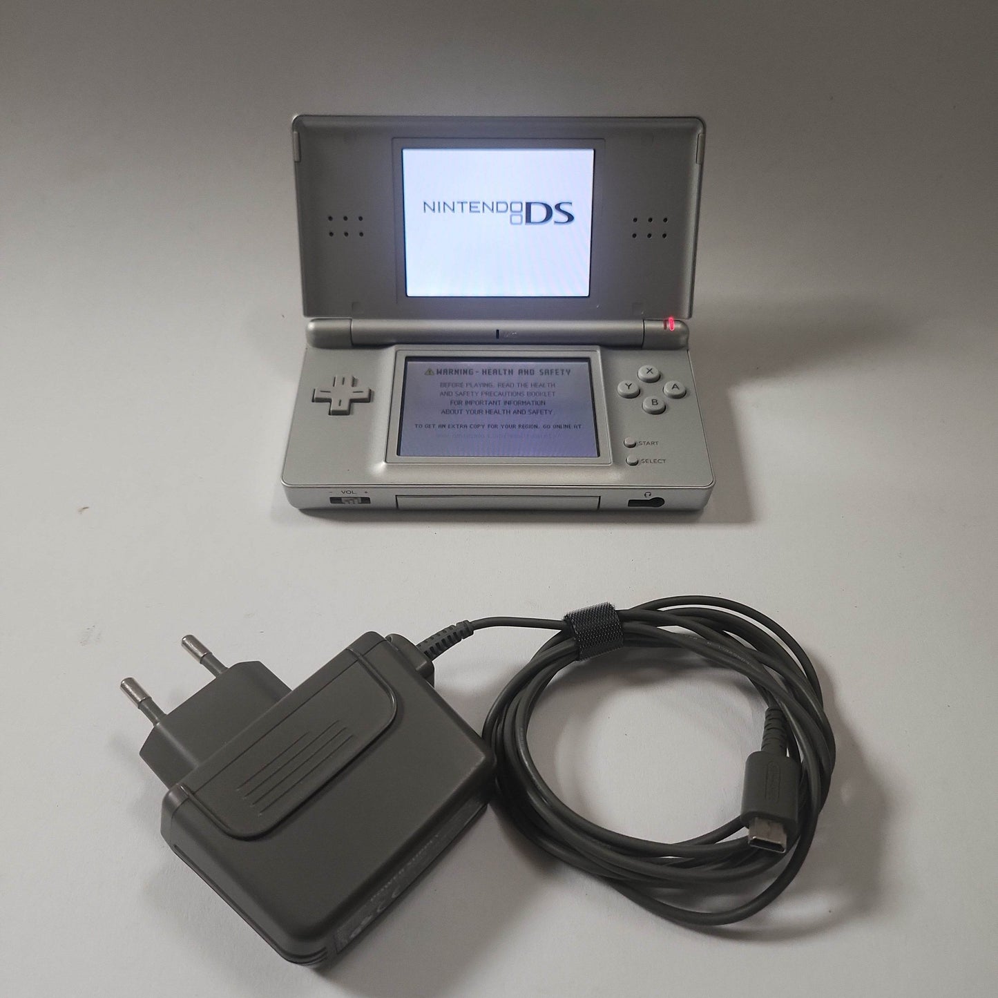 Zilveren DS Lite + oplader - Feniks Gameshop
