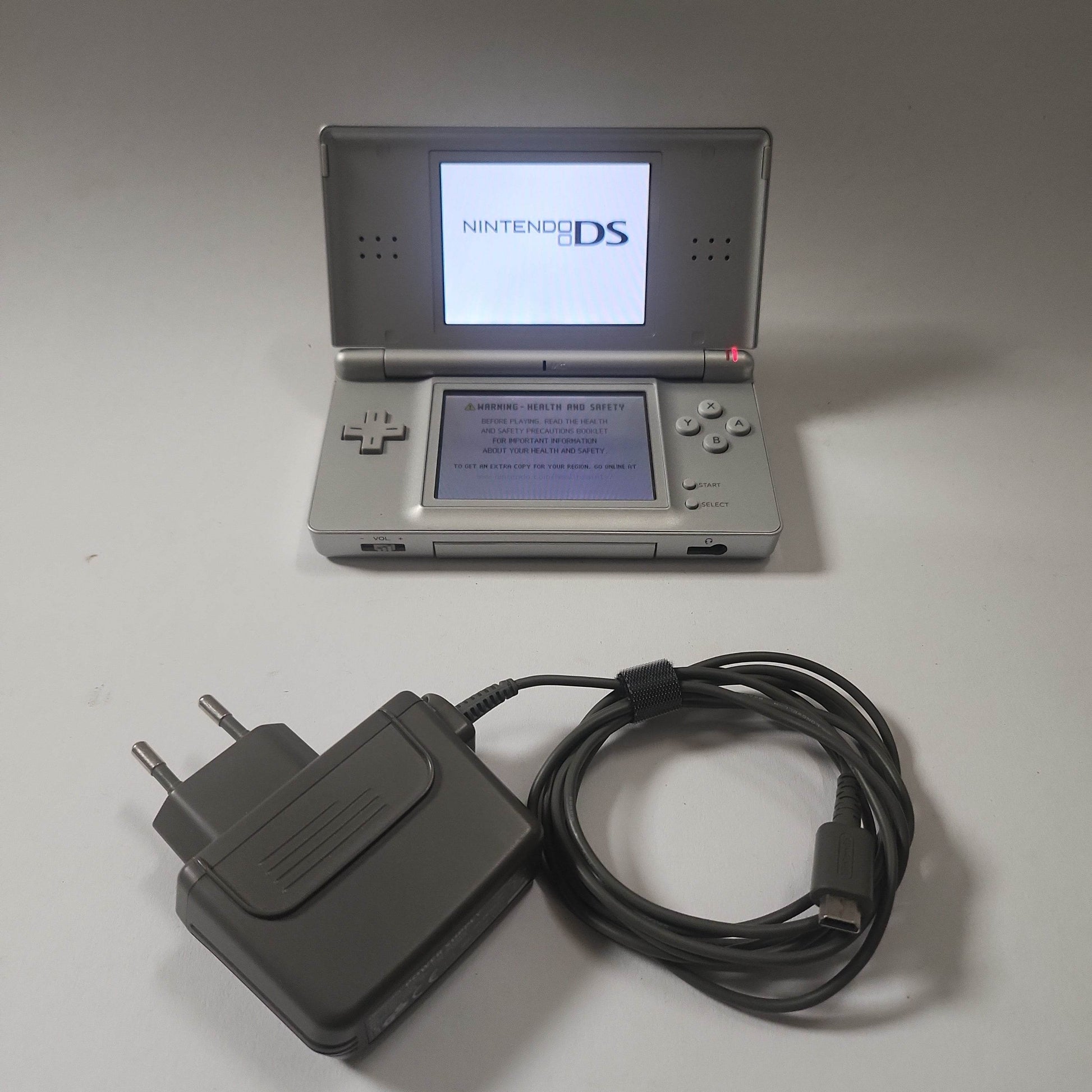 Zilveren DS Lite + oplader - Feniks Gameshop
