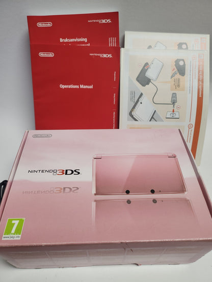 Rosa Nintendo 3DS im Karton mit sämtlichem Zubehör und Broschüren