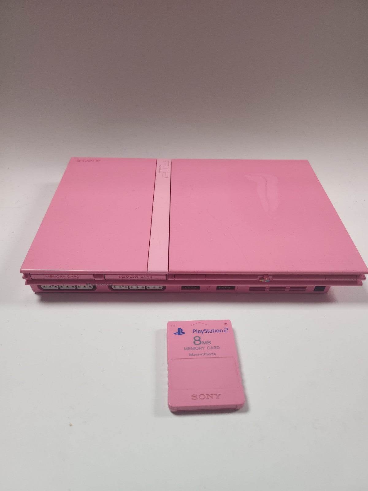 Roze Playstation 2, 2 controllers, roze memorycard en alle kabels - Feniks Gameshop